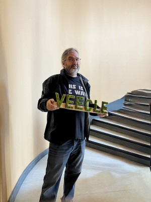 Veecle sign held up in the office