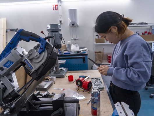 Engineer working on hardware in the Berlin garage